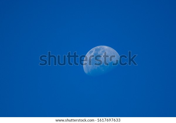 moon in blue sky of\
Cordoba