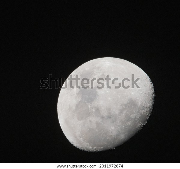 The moon up close in a clear\
sky