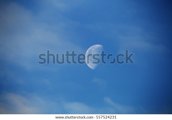 Moon close-up in blue sky. White moon in sky. Night\
sky with moon