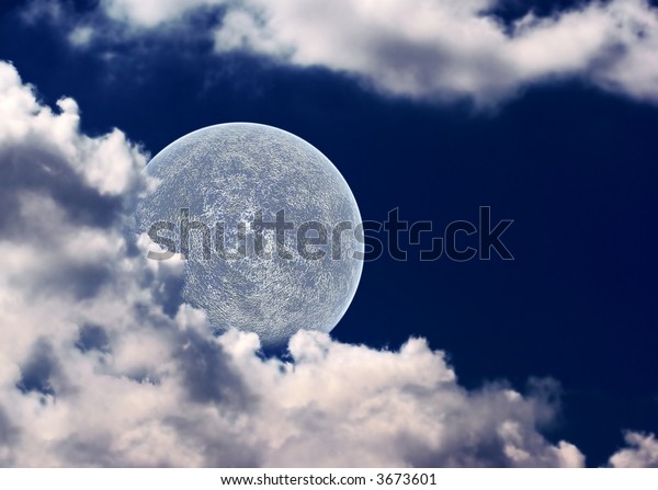 The moon\
in clouds on a background of the night\
sky.