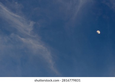moon with clouds at sunet