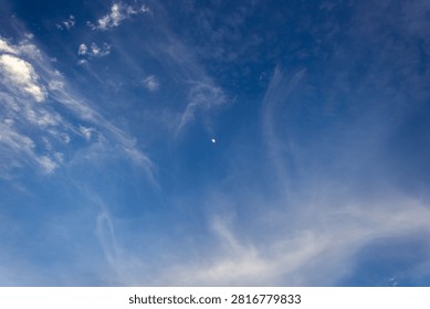 moon with clouds at sunet