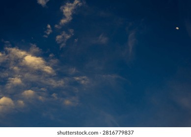 moon with clouds at sunet