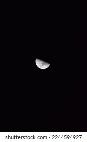 The Moon in the cloudy sky