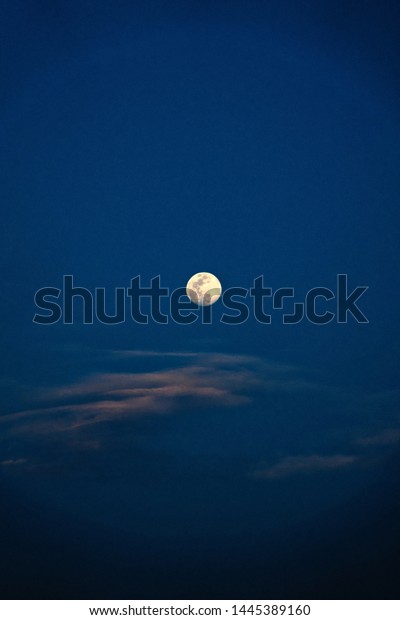 moon.\
Colorful sky with cloud and bright moon. Serenity nature\
background, outdoor at nighttime. Cross\
process.