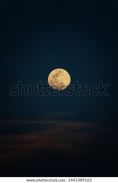 moon.
Colorful sky with cloud and bright moon. Serenity nature
background, outdoor at nighttime. Cross
process.
