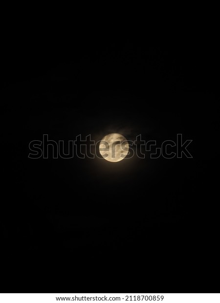 The moon in the\
darkness.