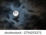 Moon at dawn between the clouds in Madrid