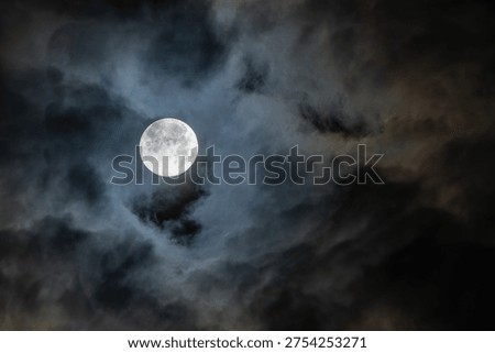 Moon at dawn between the clouds in Madrid
