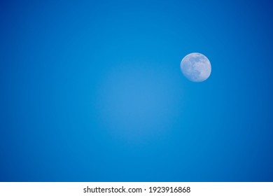 Moon Day Time On A Background Of Blue Sky