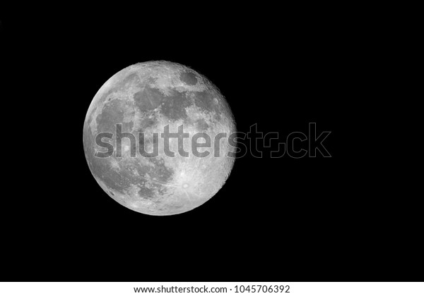 Moon detail / The Moon is an astronomical body\
that orbits planet Earth, being Earth\'s only permanent natural\
satellite. It is the fifth-largest natural satellite in the Solar\
System, and the largest 