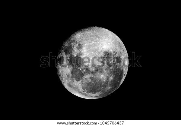Moon detail / The Moon is an astronomical body\
that orbits planet Earth, being Earth\'s only permanent natural\
satellite. It is the fifth-largest natural satellite in the Solar\
System, and the largest 