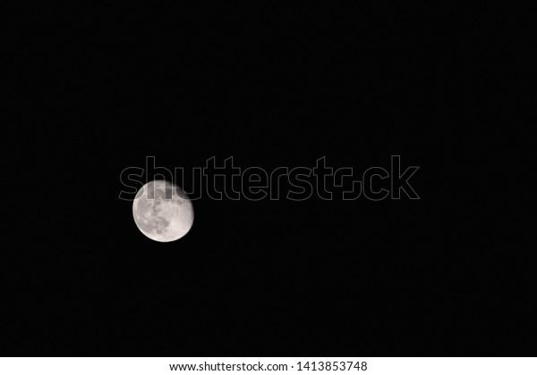 The moon during the\
darkness of the night