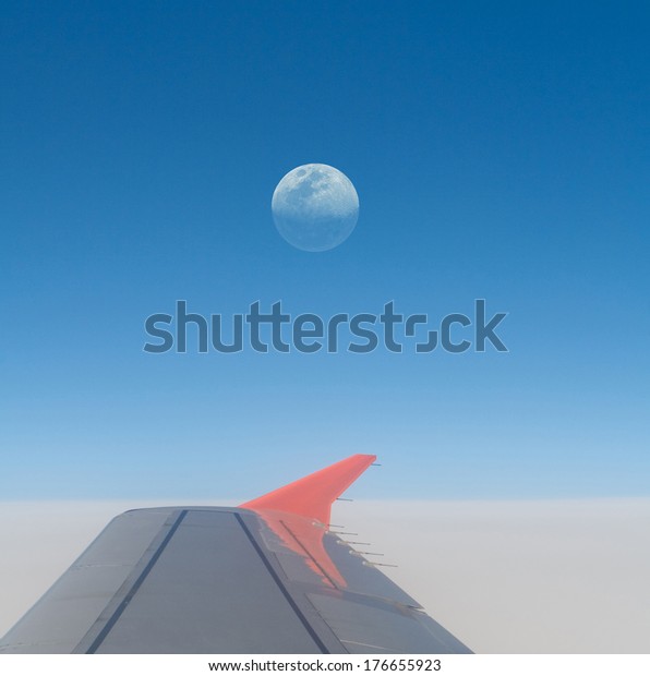 Moon eclipse and airplane wing - sharp details on the\
Moon. 
