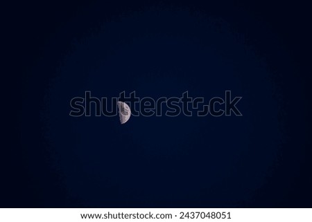 Similar – Image, Stock Photo Increasing crescent moon in dark blue evening sky with light clouds, moon craters and moon seas are visible