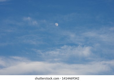 Moon floating in the daylight