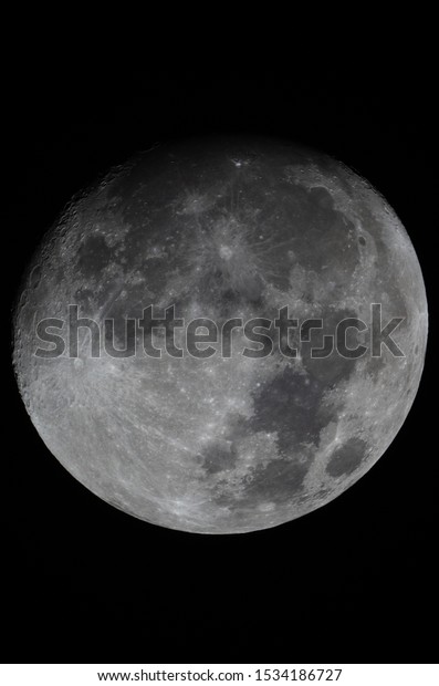 Moon full frame with shadow\
line.