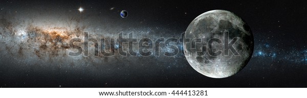 The moon with glowing stars on the\
background. \