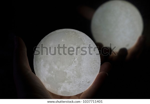 Moon in a\
hand