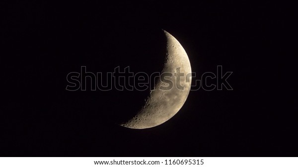 Moon with light cloud quarter\
