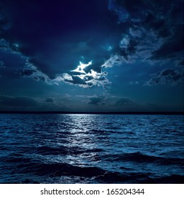 Moon Light Over Darken Water In Night