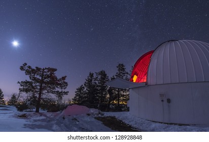 The Moon Lights Up The Observatory Containing The Schulman Telescope On Mount Lemmon During Their Skycenter Public Outreach Program. The City Of Tucson, Arizona Glows In The Distance.