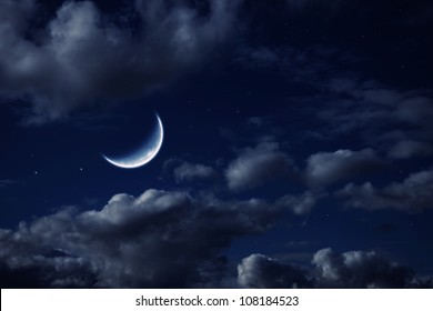 The Moon In The Night Cloudy Sky With Stars