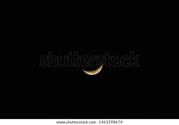 The moon\
at night. Moon with dark black\
background.