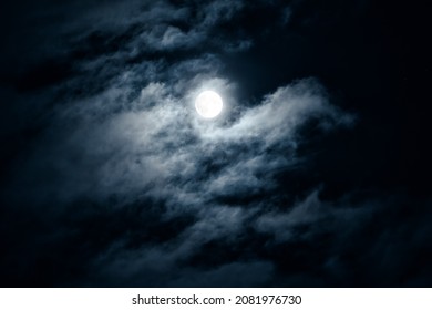 Moon In Night Sky, Dark Gothic Background. Dramatic Clouds In Moonlight From Full Moon. Concept Of Horror, Halloween Theme And Spooky Mystery. 