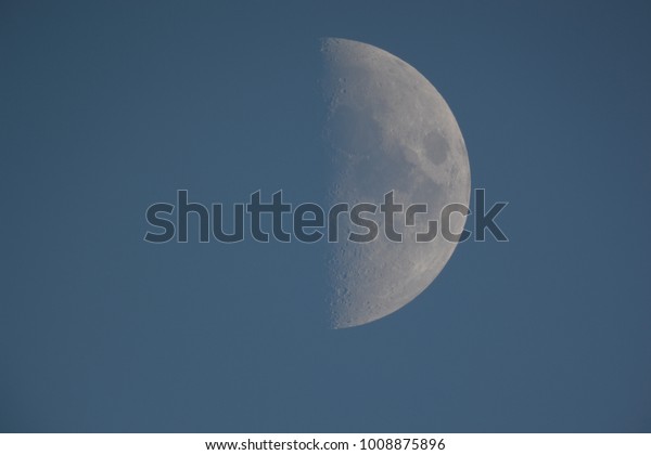 Moon in the night sky. Moon, earth\
satellite in the night sky in the vastness of deep\
space