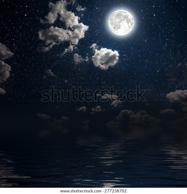 moon on a background star sky
reflected in the sea. Elements of this image furnished by
NASA