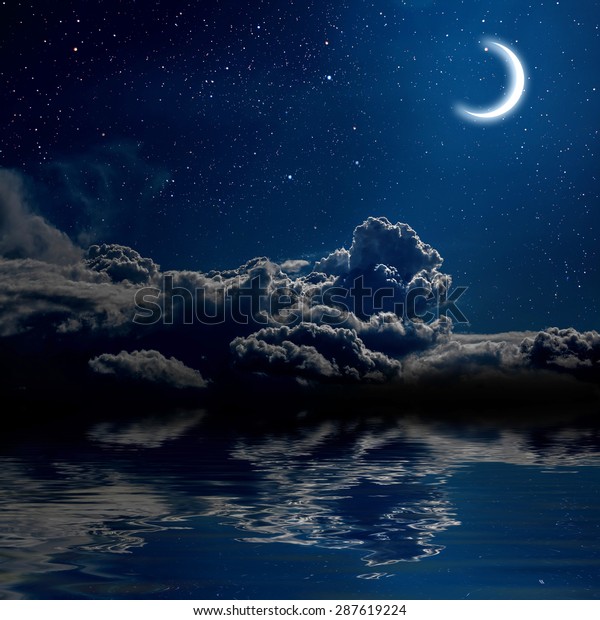 moon on a background star sky\
reflected in the sea. Elements of this image furnished by\
NASA