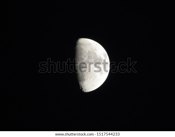 Moon on black sky
background