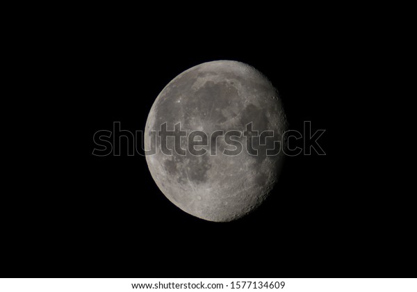 The\
Moon, on a clear night, seen through a\
telescope