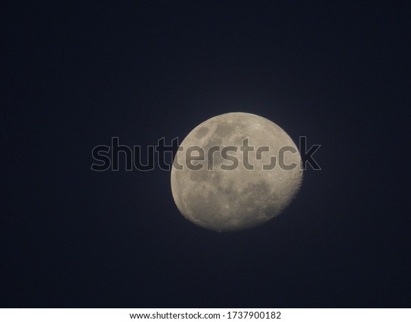 Moon on cloudy night (close\
up)