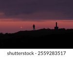 Moon on the road to Santiago. The moon at sunset on Mount Jaizkibel. Way of St. James or Northern Way, Euskadi