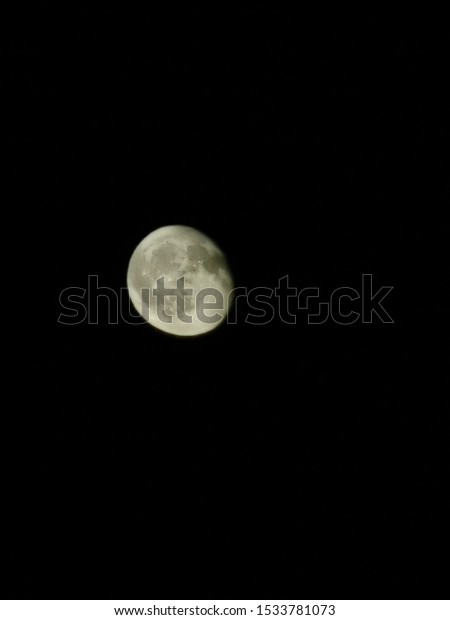 Moon out on a clear night\
sky 