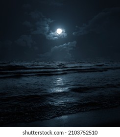 Moon Over Blue Sea Or Ocean. Night View. A Good Background For The Theme Of Travel, Vacation, Voyage.