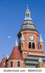 Moon over the clock tower of Old Red Museum in Dallas, Texas