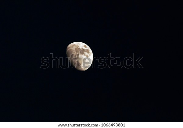 moon over dark black sky at night , moon background.\
Phase of the moon,  Highly detailed photo of the bright moon in the\
night sky