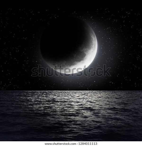 Moon over sea surface with reflection. Elements\
of this image furnished by\
NASA
