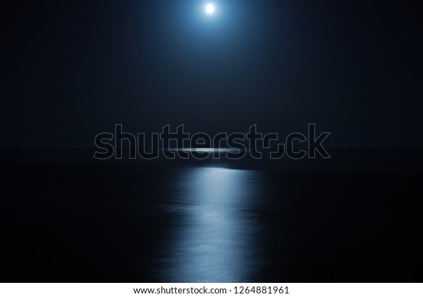 Moon reflection on the sea\
at night