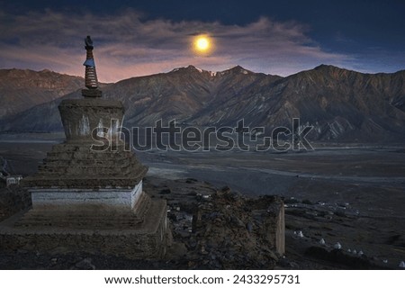 Moon rise in the Zanskar valley with a buddhist stupa in front