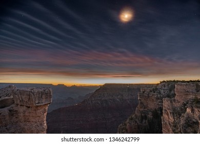 Moon Rising Over The Grand Canyon Just Before Sunrise