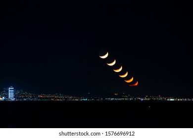 Moon set over city at night. Different moments of moon set on the same frame. Phases of the moon.