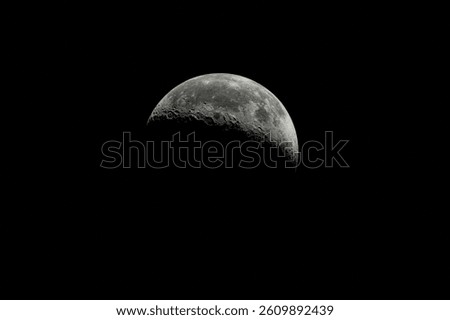 Moon with shadow in dark space. Moon surface with craters. 
