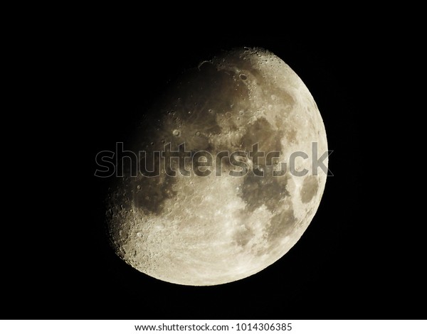 moon in shadows in dark\
sky