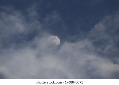 moon shining behind the clouds