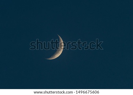 
Moon slice in the dark sky