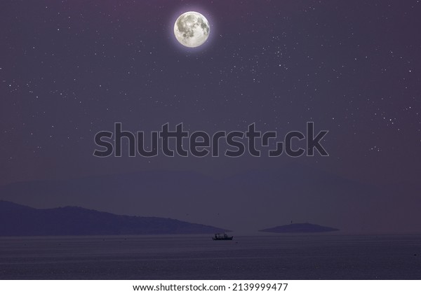 Moon and starry sky over lake\
